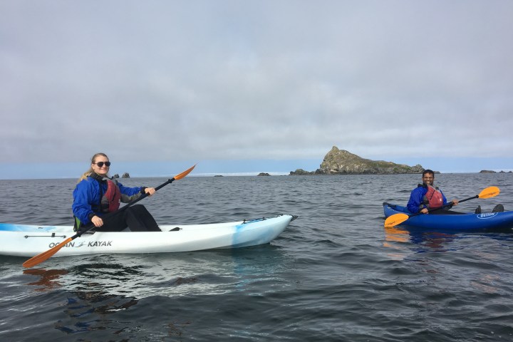 Two ocean kayakers smiling for the camera