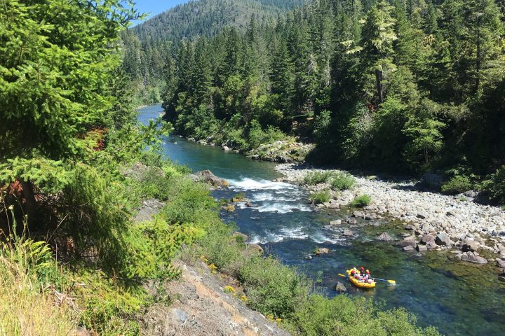 aerial view of white water rafters navigating down rapids